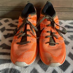 Women’s bright orange Nikes shoes size 7.5